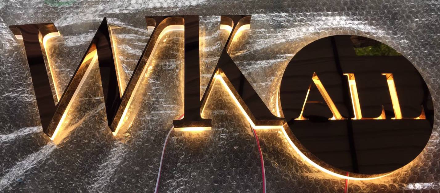 #ป้ายอักษรไฟออกหลัง #ป้ายอักษรสแตนเลสหน้าทองเงาไฟออกหลัง