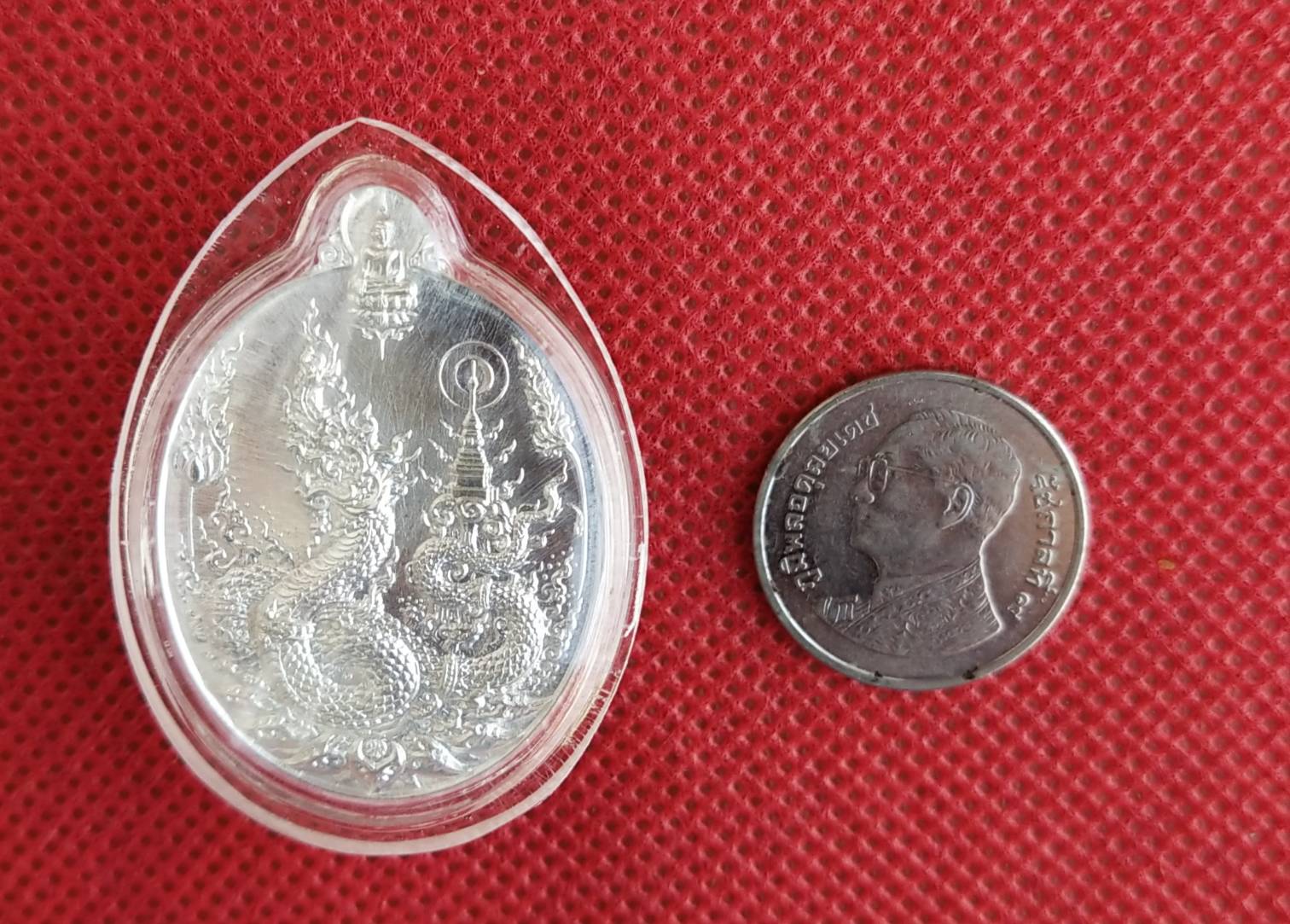 เหรียญพญานาค รุ่น "คลังสมบัติ" วัดศรีโคมคำ (วัดพระเจ้าตนหลวง) จ.พะเยา เนื้อเงิน ปี 2560